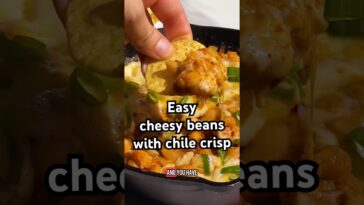Cheesy chile crisp white beans? So good. Full recipe in the description! #cheese #recipe #shorts